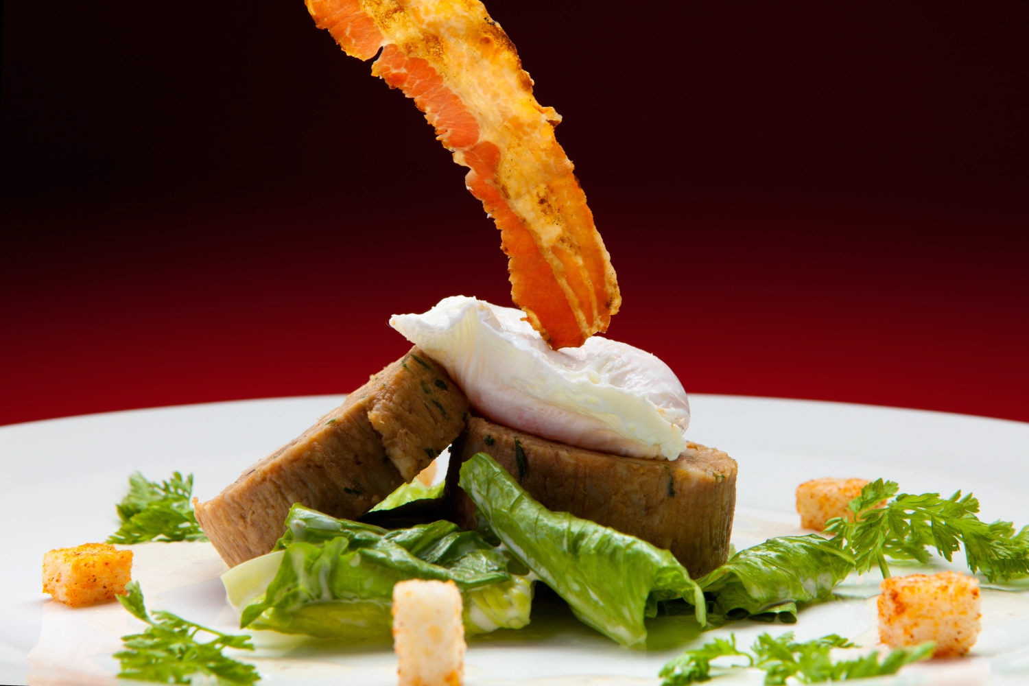 Classic Caesar salad with a Ballantine of chicken,poached egg and crispy pancetta  by Sandy Bohm